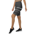 Load image into Gallery viewer, Introducing Elevated Essence Biker Shorts, the perfect choice for the active woman on-the-go! These shorts feature a high-rise waistband that smooths and supports your figure while providing maximum comfort during any activity. The unique design of white lines traversing dark grey fabric not only looks stylish but also elevates your spirit, making you feel confident and empowered.