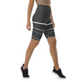Load image into Gallery viewer, Introducing Elevated Essence Biker Shorts, the perfect choice for the active woman on-the-go! These shorts feature a high-rise waistband that smooths and supports your figure while providing maximum comfort during any activity. The unique design of white lines traversing dark grey fabric not only looks stylish but also elevates your spirit, making you feel confident and empowered.