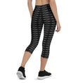 Load image into Gallery viewer, Step into a realm of style and confidence with our Checkmate capri leggings. These leggings are the perfect blend of fashion and functionality, designed to enhance your performance and make a bold statement.