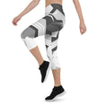 Load image into Gallery viewer, Experience the perfect blend of fashion and function with Neo Weave capri leggings. These leggings feature a dynamic, geometric design that will turn heads wherever you go. The breathable, moisture-wicking fabric will keep you cool and dry, while the form-fitting, high-rise cut will provide a flattering and comfortable fit.