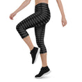 Load image into Gallery viewer, Step into a realm of style and confidence with our Checkmate capri leggings. These leggings are the perfect blend of fashion and functionality, designed to enhance your performance and make a bold statement.