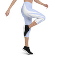 Load image into Gallery viewer, Picture yourself in a pair of Altitude capri leggings, the sky blue hue evoking feelings of soaring heights. The ultra-soft and stretchy fabric effortlessly hugs your curves, providing both comfort and style.