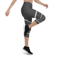 Load image into Gallery viewer, Elevate your wardrobe with these Elevated Essence Capris, the perfect addition to your athleisure collection. These capris feature a sleek and stylish design with white horizontal lines on a dark grey base, creating a striking yet versatile look that can be dressed up or down. The four-way stretch fabric ensures a comfortable and flexible fit, while the high-rise waistband offers support and coverage.
