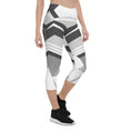 Load image into Gallery viewer, Experience the perfect blend of fashion and function with Neo Weave capri leggings. These leggings feature a dynamic, geometric design that will turn heads wherever you go. The breathable, moisture-wicking fabric will keep you cool and dry, while the form-fitting, high-rise cut will provide a flattering and comfortable fit.