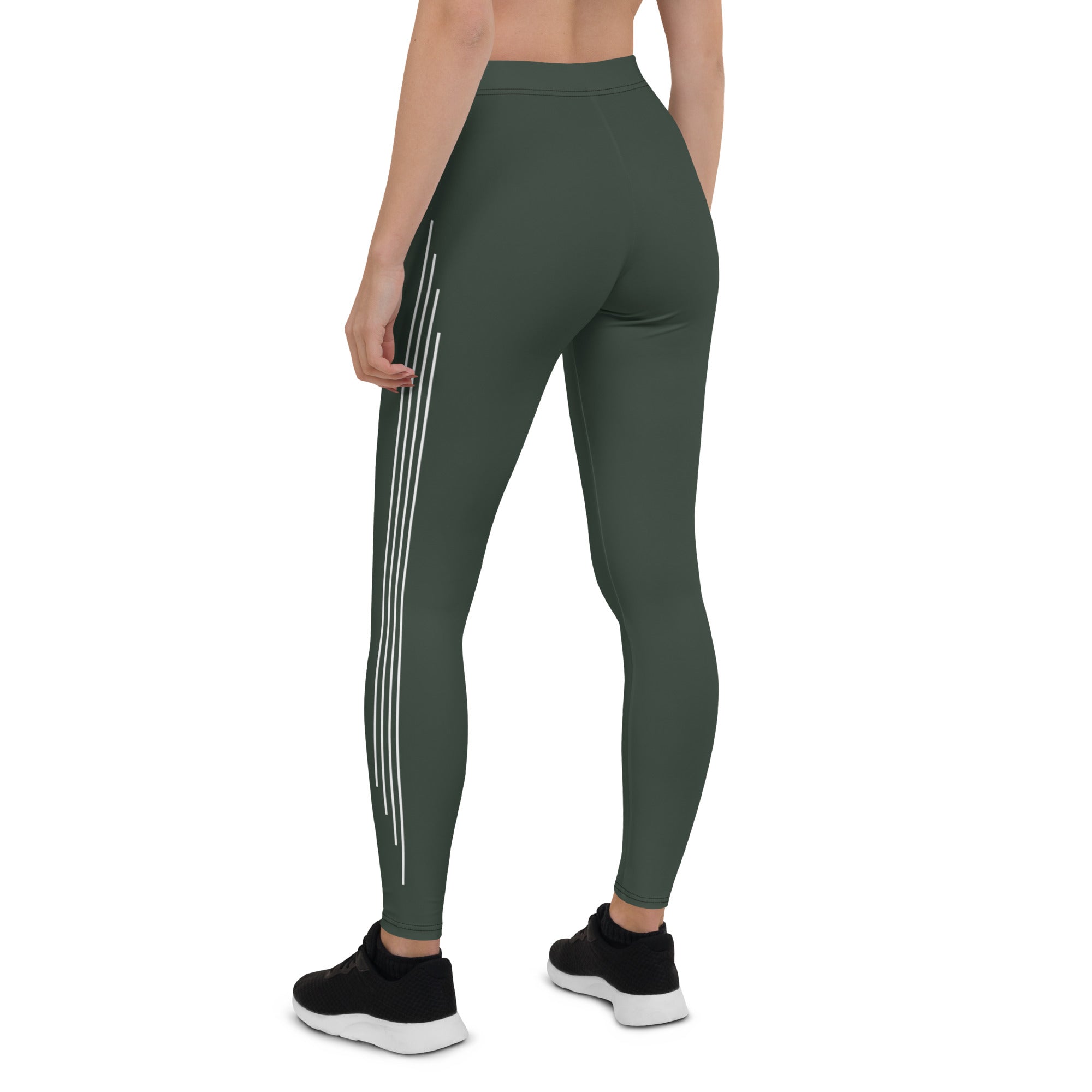Elevate your everyday look with these Jade Ascent High-Waisted Leggings. The beautiful forest green shade with ascending lines is a stunning and unique addition to your wardrobe. The slim, high-rise fit flatters your figure, while the soft synthetic material with added stretch offers comfortable movement.