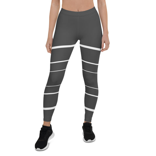 Elevate your daily style with these versatile and comfortable leggings. The unique white lines against the dark grey background make a bold statement that's perfect for any occasion. From yoga classes to brunch with friends or a night out on the town, these leggings will keep you looking and feeling your best.