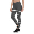 Load image into Gallery viewer, Elevate your daily style with these versatile and comfortable leggings. The unique white lines against the dark grey background make a bold statement that's perfect for any occasion. From yoga classes to brunch with friends or a night out on the town, these leggings will keep you looking and feeling your best.