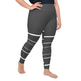 Load image into Gallery viewer, Introducing Elevated Essence plus size leggings, the perfect addition to your activewear collection! These leggings feature a flattering high-waisted design and a stretchy fit that hugs your curves in all the right places. The dark grey fabric is elevated by the striking white lines that add a touch of elegance to your workout look. Whether you're hitting the hiking trails, practicing yoga, or simply running errands, these leggings will keep you comfortable and confident.