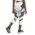 Load image into Gallery viewer, Discover the perfect blend of style and comfort with our Neo Weave yoga capris. These high-waisted capris feature a cutting-edge geometric design that's sure to turn heads at the gym or on the street. The quick-dry, moisture-wicking fabric keeps you cool and dry even during your toughest workouts, while the four-way stretch ensures unrestricted movement.