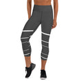 Load image into Gallery viewer, Elevate your active wardrobe with our Elevated Essence Yoga Capris. The sleek and comfortable design of these capris make them perfect for any activity, from hiking and biking to gardening and traveling. The high-quality fabric wicks away sweat and dries quickly, so you can stay comfortable during even the most intense workouts.