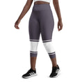 Load image into Gallery viewer, Indulge in sweet dreams with Lavender Dreams yoga capri leggings. These leggings boast a delightful lavender color with eye-catching white banding. Perfect for yoga, the gym, or casual wear, these leggings offer a flattering fit and superior comfort that will make them your go-to choice.