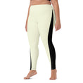 Load image into Gallery viewer, Whether you're hitting the studio or the streets, our Lemon Slice yoga pants have got you covered. The pale yellow color is complemented by a bold black triangle design, creating a unique look that's sure to stand out.