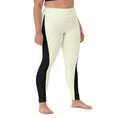 Load image into Gallery viewer, Whether you're hitting the studio or the streets, our Lemon Slice yoga pants have got you covered. The pale yellow color is complemented by a bold black triangle design, creating a unique look that's sure to stand out.