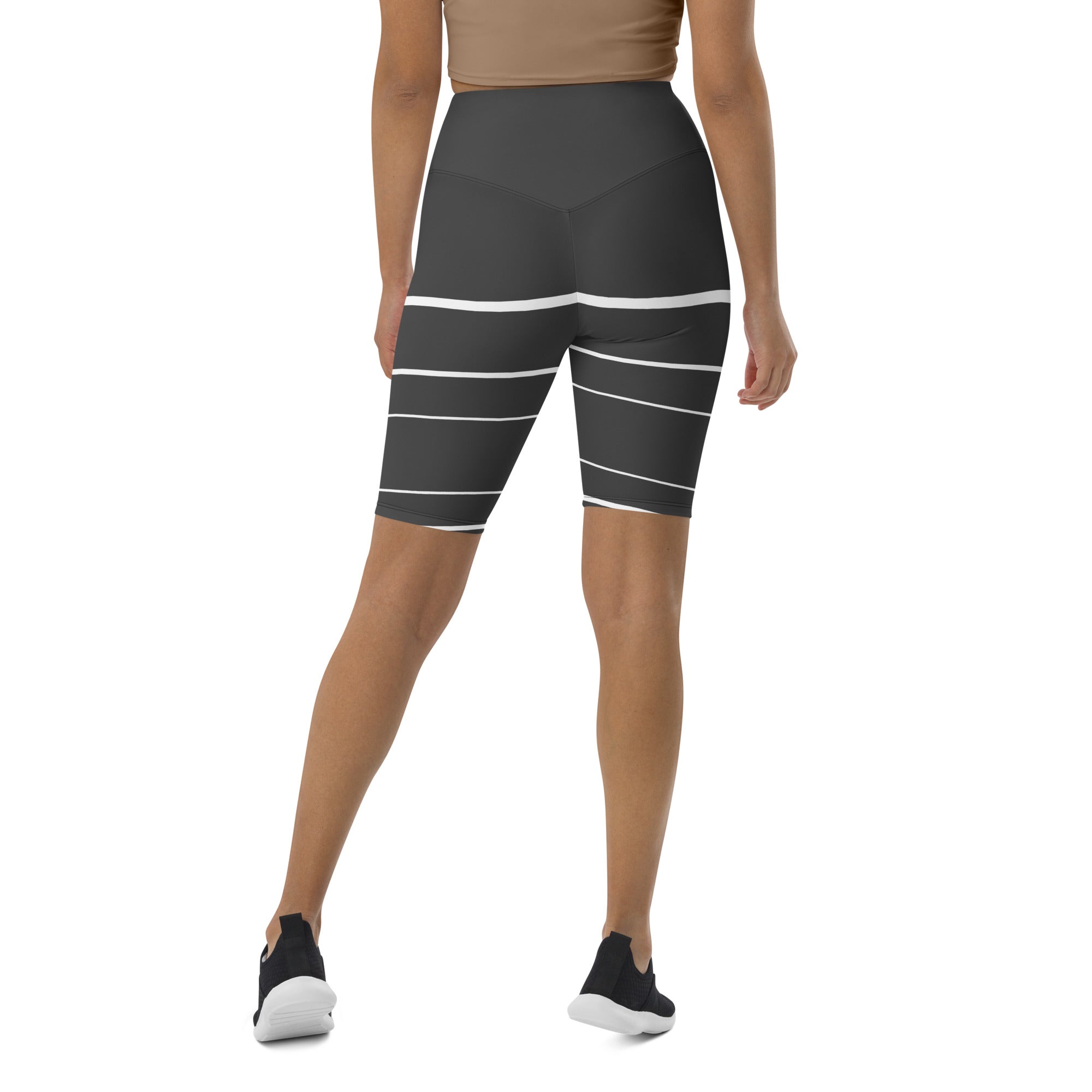 Introducing Elevated Essence Biker Shorts, the perfect choice for the active woman on-the-go! These shorts feature a high-rise waistband that smooths and supports your figure while providing maximum comfort during any activity. The unique design of white lines traversing dark grey fabric not only looks stylish but also elevates your spirit, making you feel confident and empowered.