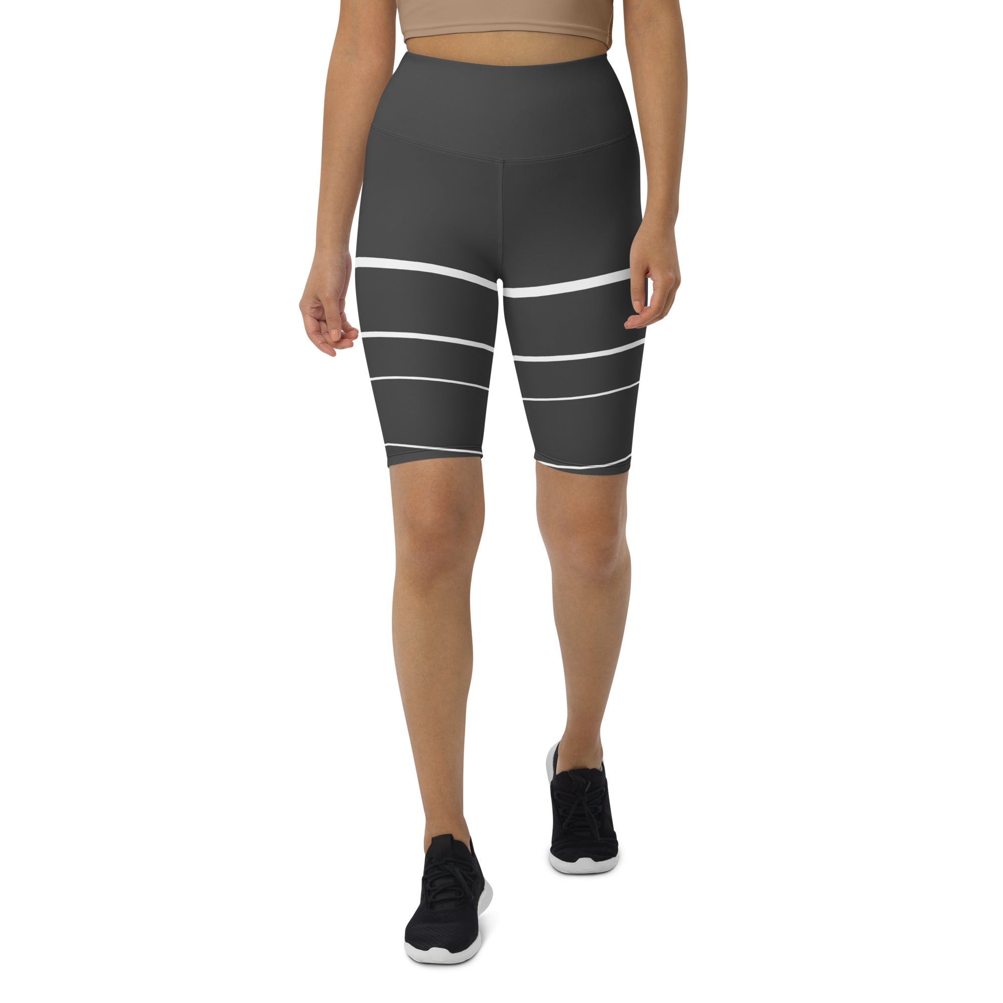 Introducing Elevated Essence Biker Shorts, the perfect choice for the active woman on-the-go! These shorts feature a high-rise waistband that smooths and supports your figure while providing maximum comfort during any activity. The unique design of white lines traversing dark grey fabric not only looks stylish but also elevates your spirit, making you feel confident and empowered.