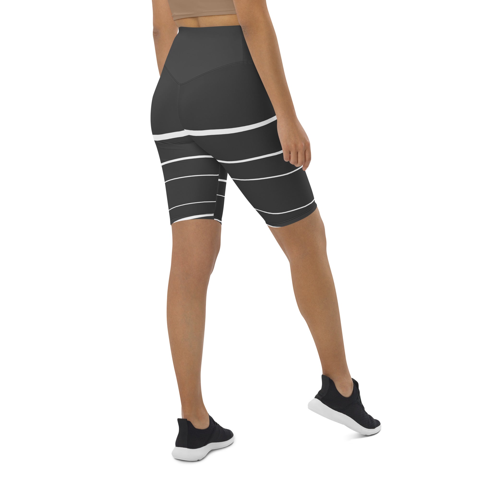 Introducing Elevated Essence Biker Shorts, the perfect choice for the active woman on-the-go! These shorts feature a high-rise waistband that smooths and supports your figure while providing maximum comfort during any activity. The unique design of white lines traversing dark grey fabric not only looks stylish but also elevates your spirit, making you feel confident and empowered.