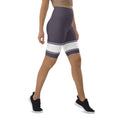 Load image into Gallery viewer, Whether you're running pavements or running errands, these Lavender Dreams biker shorts are the perfect choice. The comfortable, flexible fabric and high-rise waistband provide a flattering fit, while the white banding adds a touch of sophistication. Available in a range of sizes, these shorts are perfect for any body type.
