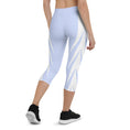 Load image into Gallery viewer, Picture yourself in a pair of Altitude capri leggings, the sky blue hue evoking feelings of soaring heights. The ultra-soft and stretchy fabric effortlessly hugs your curves, providing both comfort and style.
