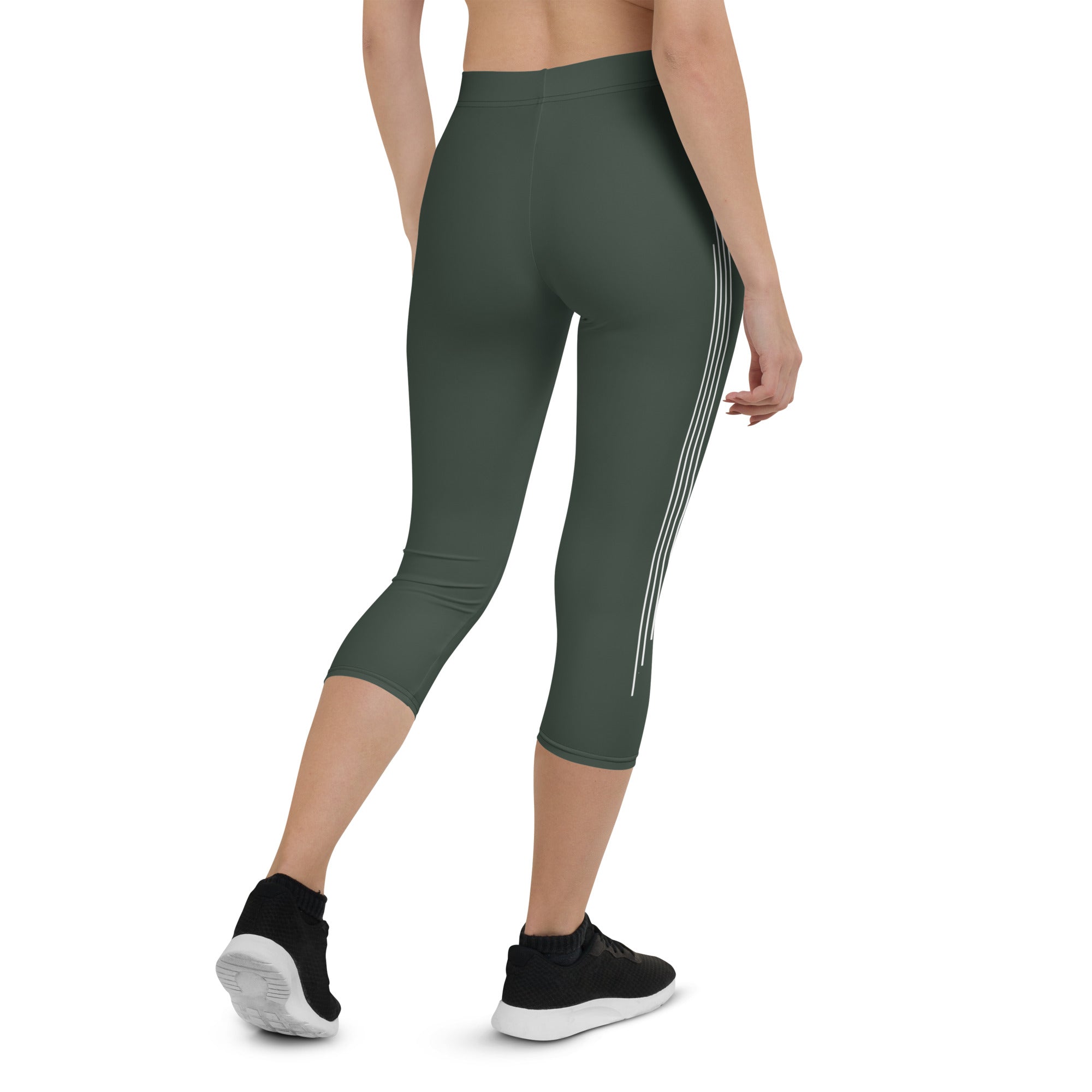 Introducing our Jade Ascent capri leggings - the ultimate companion for your yoga practice or morning jog. Crafted from a buttery-soft fabric, these leggings offer maximum flexibility and support, allowing you to move with complete ease and freedom.