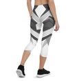 Load image into Gallery viewer, Experience the perfect blend of fashion and function with Neo Weave capri leggings. These leggings feature a dynamic, geometric design that will turn heads wherever you go. The breathable, moisture-wicking fabric will keep you cool and dry, while the form-fitting, high-rise cut will provide a flattering and comfortable fit.
