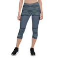 Load image into Gallery viewer, These Blue Prism capris are not just comfortable, they're also designed to keep you moving in style! With a trendy diamond-scale pattern in varying shades of blue, you'll feel energized and ready to take on any workout.
