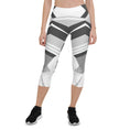 Load image into Gallery viewer, Experience the perfect blend of fashion and function with Neo Weave capri leggings. These leggings feature a dynamic, geometric design that will turn heads wherever you go. The breathable, moisture-wicking fabric will keep you cool and dry, while the form-fitting, high-rise cut will provide a flattering and comfortable fit.
