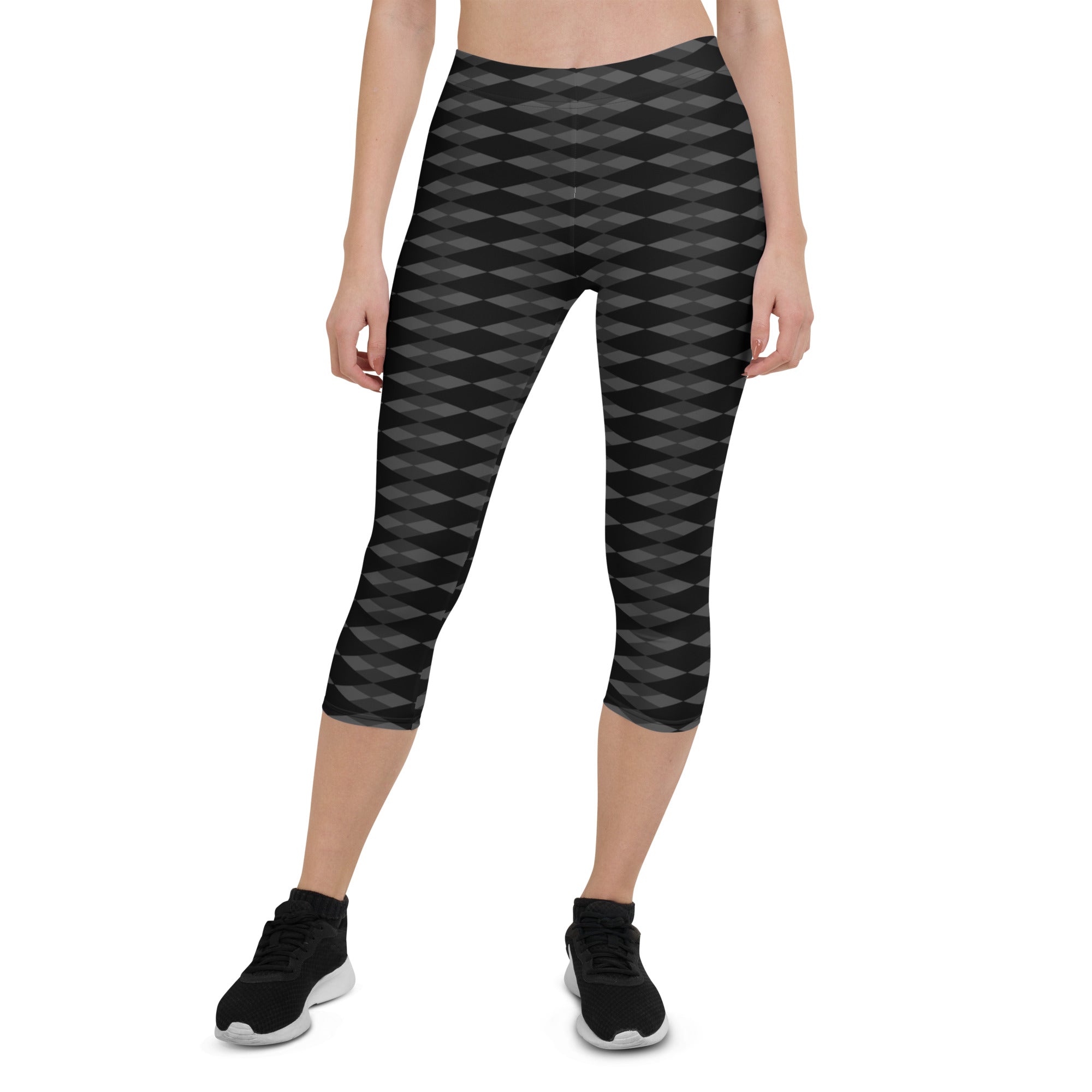 Step into a realm of style and confidence with our Checkmate capri leggings. These leggings are the perfect blend of fashion and functionality, designed to enhance your performance and make a bold statement.