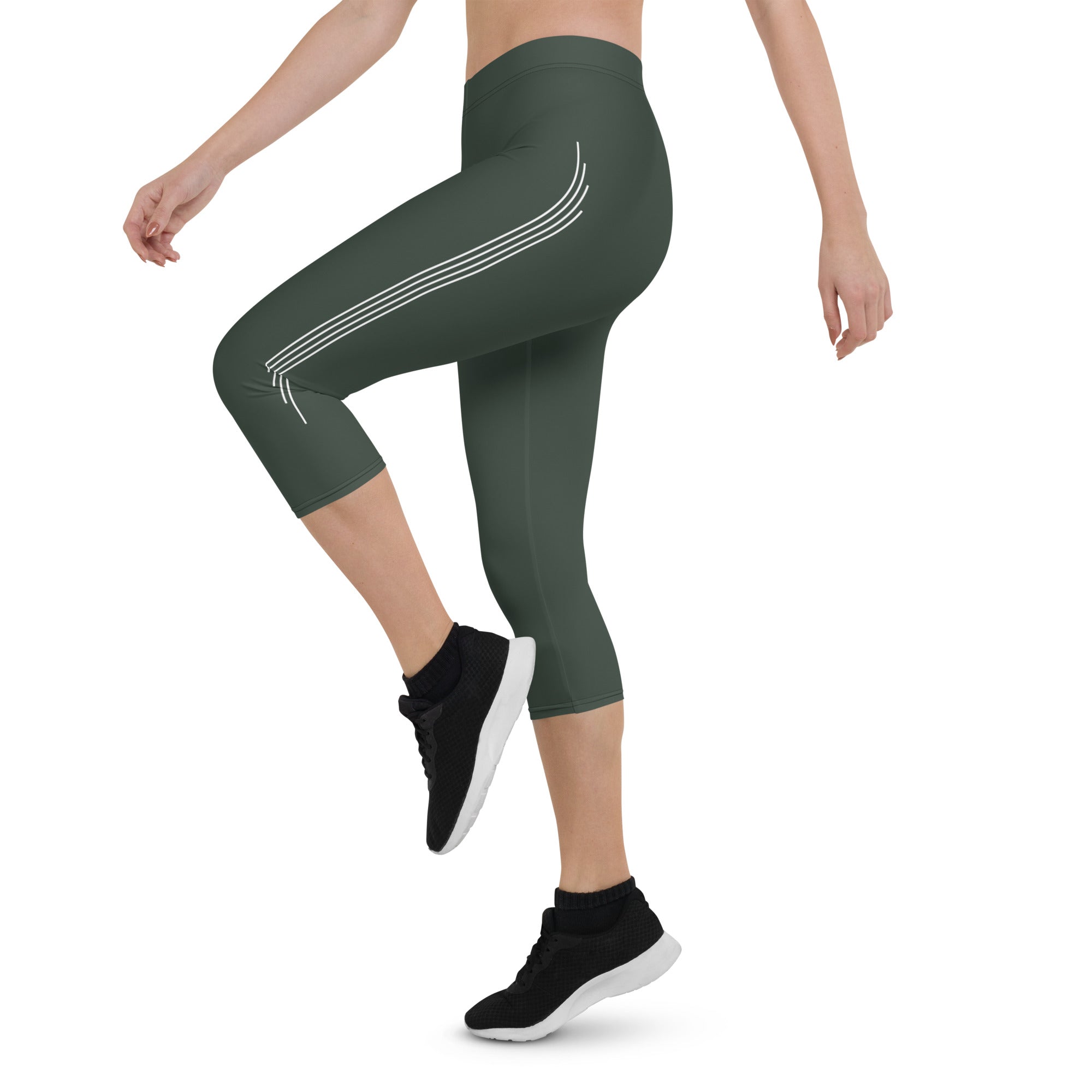 Introducing our Jade Ascent capri leggings - the ultimate companion for your yoga practice or morning jog. Crafted from a buttery-soft fabric, these leggings offer maximum flexibility and support, allowing you to move with complete ease and freedom.