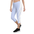 Load image into Gallery viewer, Picture yourself in a pair of Altitude capri leggings, the sky blue hue evoking feelings of soaring heights. The ultra-soft and stretchy fabric effortlessly hugs your curves, providing both comfort and style.
