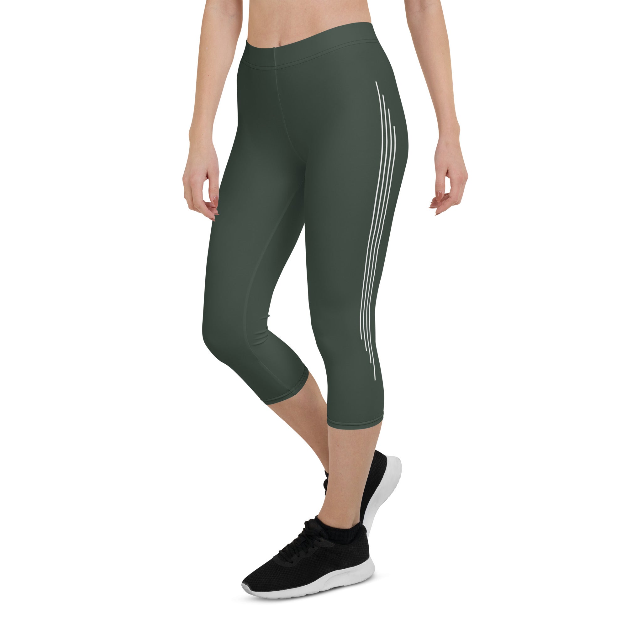 Introducing our Jade Ascent capri leggings - the ultimate companion for your yoga practice or morning jog. Crafted from a buttery-soft fabric, these leggings offer maximum flexibility and support, allowing you to move with complete ease and freedom.