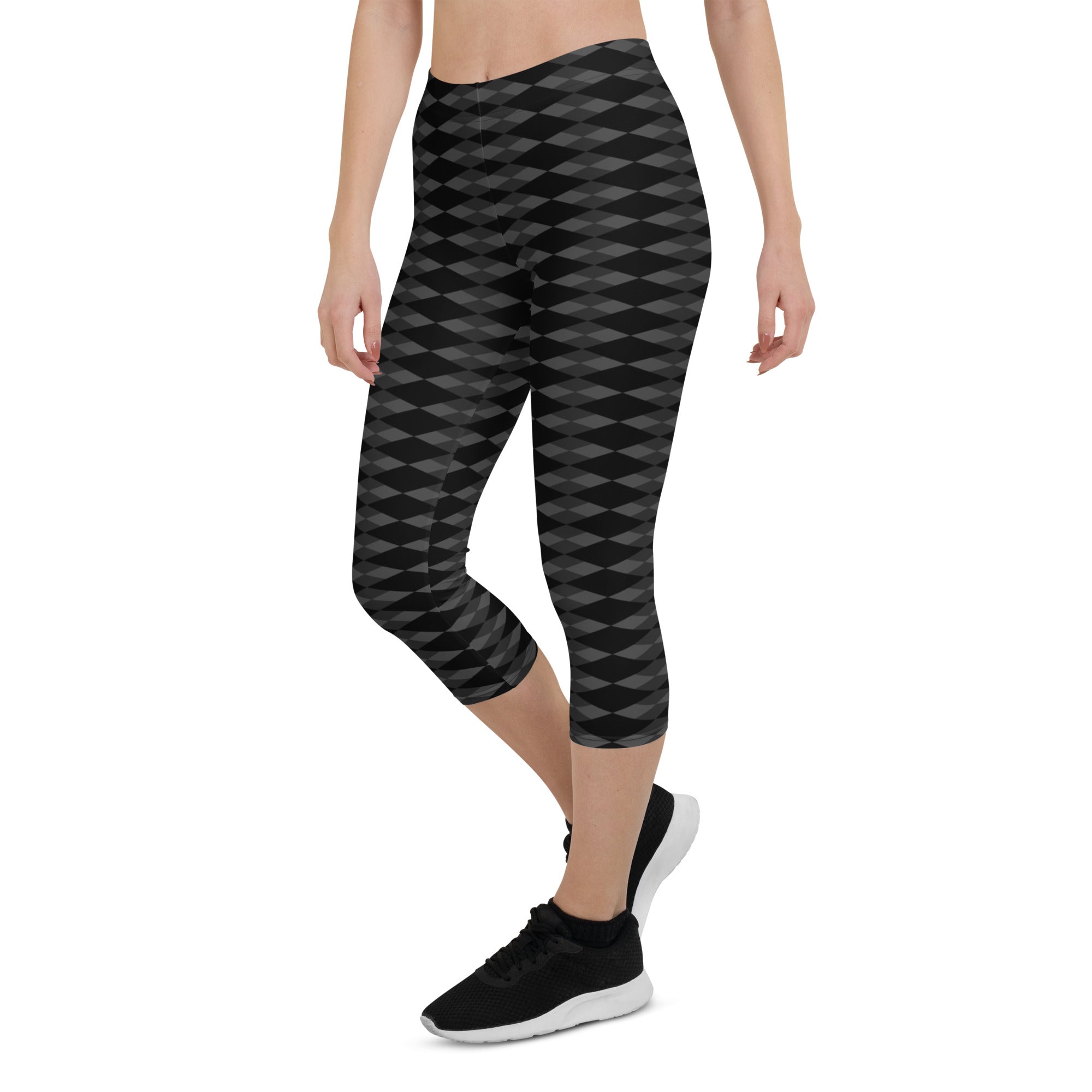 Step into a realm of style and confidence with our Checkmate capri leggings. These leggings are the perfect blend of fashion and functionality, designed to enhance your performance and make a bold statement.