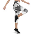 Load image into Gallery viewer, Experience the perfect blend of fashion and function with Neo Weave capri leggings. These leggings feature a dynamic, geometric design that will turn heads wherever you go. The breathable, moisture-wicking fabric will keep you cool and dry, while the form-fitting, high-rise cut will provide a flattering and comfortable fit.
