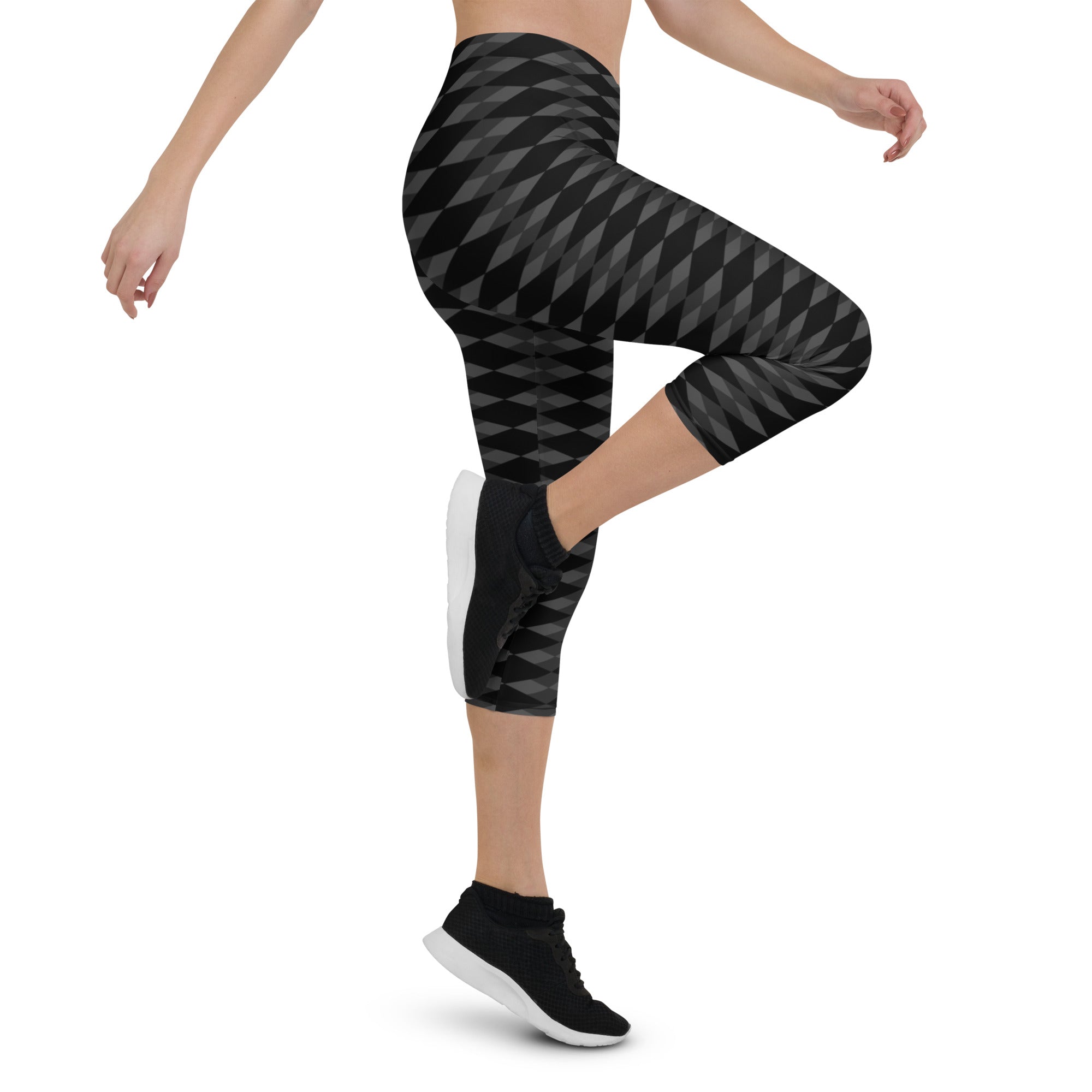 Step into a realm of style and confidence with our Checkmate capri leggings. These leggings are the perfect blend of fashion and functionality, designed to enhance your performance and make a bold statement.