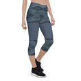 Load image into Gallery viewer, These Blue Prism capris are not just comfortable, they're also designed to keep you moving in style! With a trendy diamond-scale pattern in varying shades of blue, you'll feel energized and ready to take on any workout.
