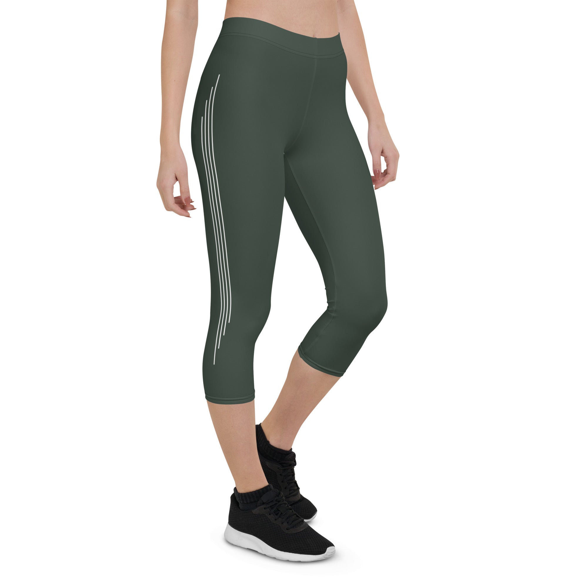 Introducing our Jade Ascent capri leggings - the ultimate companion for your yoga practice or morning jog. Crafted from a buttery-soft fabric, these leggings offer maximum flexibility and support, allowing you to move with complete ease and freedom.