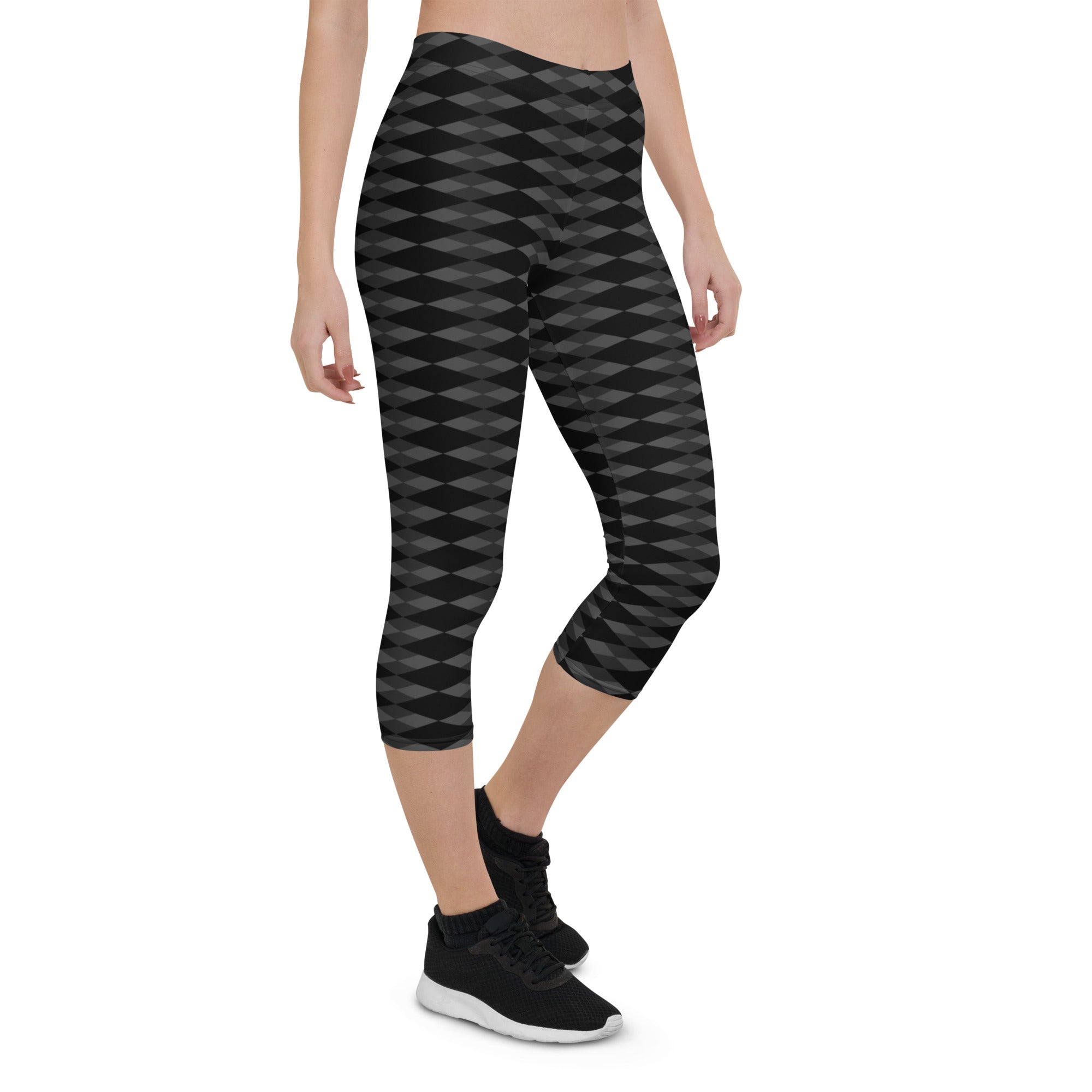 Step into a realm of style and confidence with our Checkmate capri leggings. These leggings are the perfect blend of fashion and functionality, designed to enhance your performance and make a bold statement.