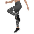 Load image into Gallery viewer, Elevate your daily style with these versatile and comfortable leggings. The unique white lines against the dark grey background make a bold statement that's perfect for any occasion. From yoga classes to brunch with friends or a night out on the town, these leggings will keep you looking and feeling your best. 
