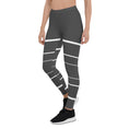 Load image into Gallery viewer, Elevate your daily style with these versatile and comfortable leggings. The unique white lines against the dark grey background make a bold statement that's perfect for any occasion. From yoga classes to brunch with friends or a night out on the town, these leggings will keep you looking and feeling your best. 
