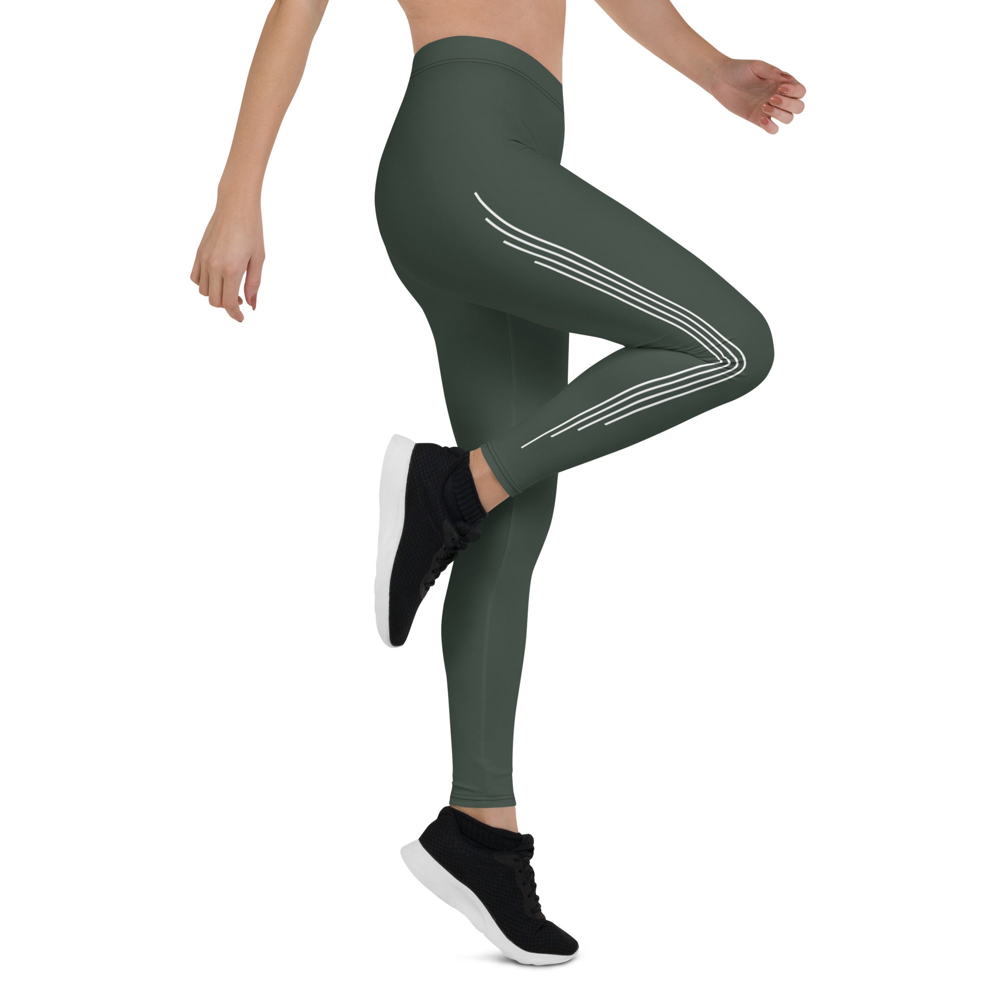 Elevate your everyday look with these Jade Ascent High-Waisted Leggings. The beautiful forest green shade with ascending lines is a stunning and unique addition to your wardrobe. The slim, high-rise fit flatters your figure, while the soft synthetic material with added stretch offers comfortable movement. 