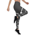 Load image into Gallery viewer, Elevate your daily style with these versatile and comfortable leggings. The unique white lines against the dark grey background make a bold statement that's perfect for any occasion. From yoga classes to brunch with friends or a night out on the town, these leggings will keep you looking and feeling your best. 
