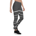 Load image into Gallery viewer, Elevate your daily style with these versatile and comfortable leggings. The unique white lines against the dark grey background make a bold statement that's perfect for any occasion. From yoga classes to brunch with friends or a night out on the town, these leggings will keep you looking and feeling your best. 
