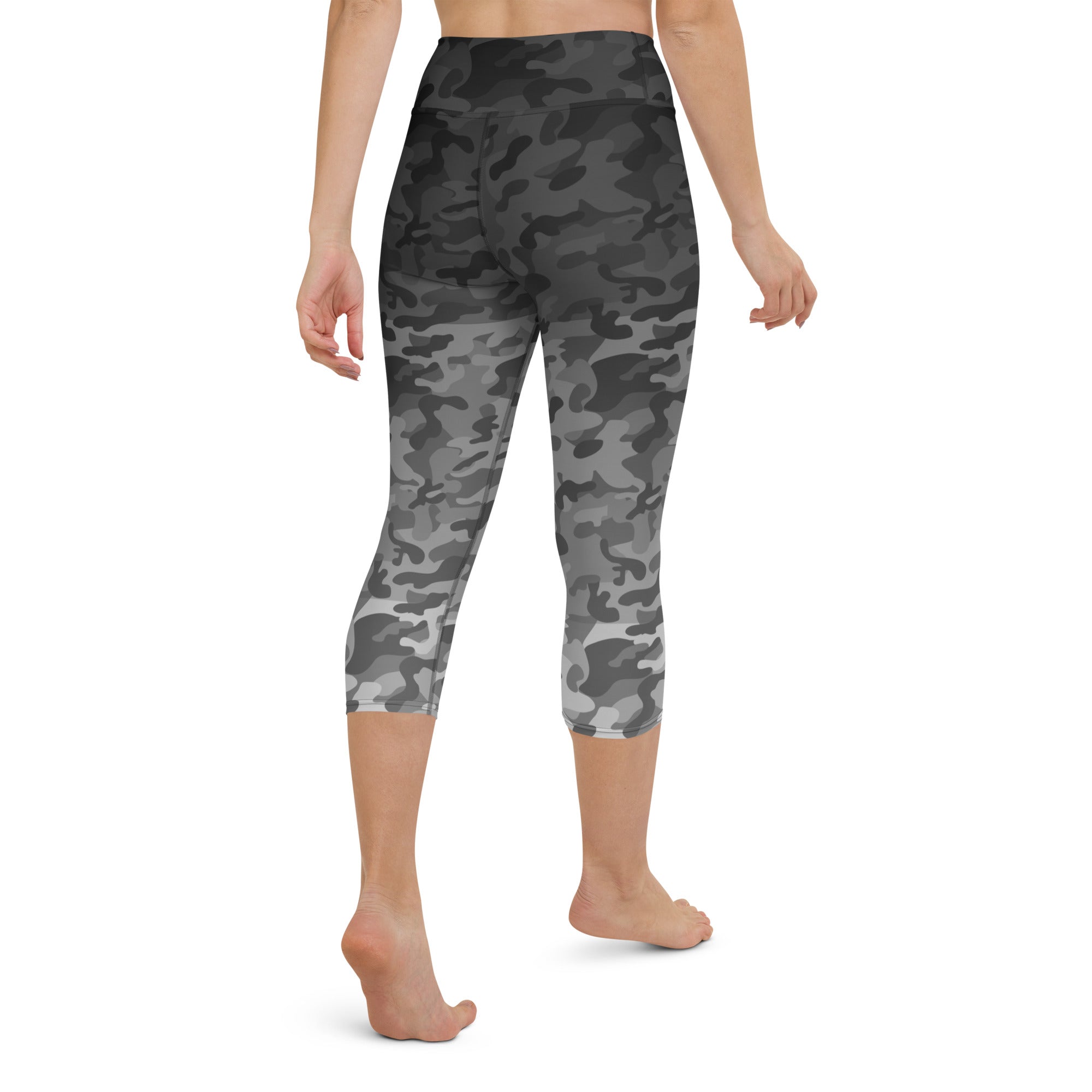 Introducing our Stealth Yoga Capri Leggings, the perfect blend of style, comfort, and performance. These leggings feature a unique camouflage gradient pattern, designed to make a statement while providing the versatility you need for any workout.