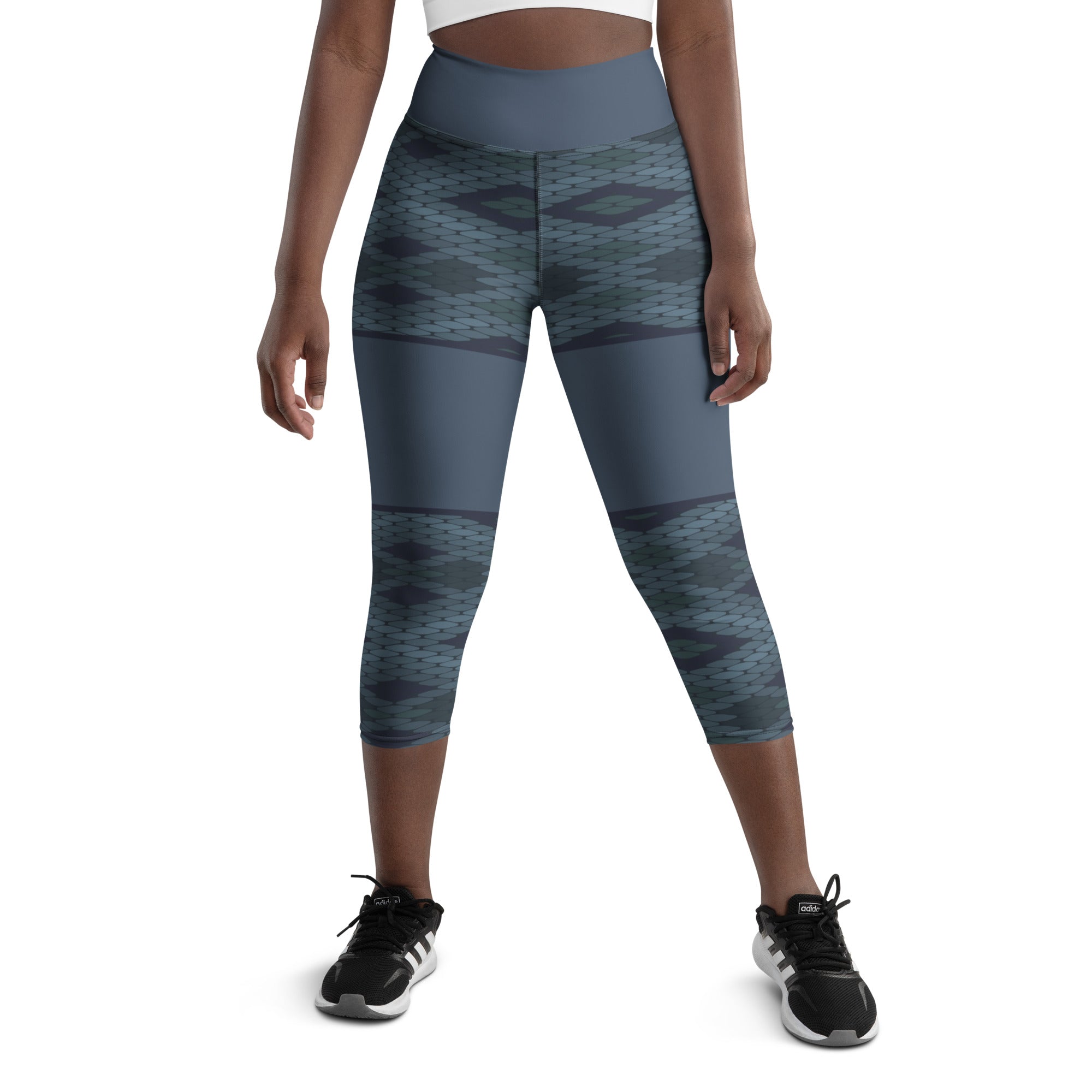 Looking for a pair of yoga capris that are both comfortable and stylish? Look no further than Blue Prism! Featuring a high, elastic waistband and a unique diamond scale pattern in various shades of blue, these capris provide a flattering fit and easy movement for any workout or lounging session.