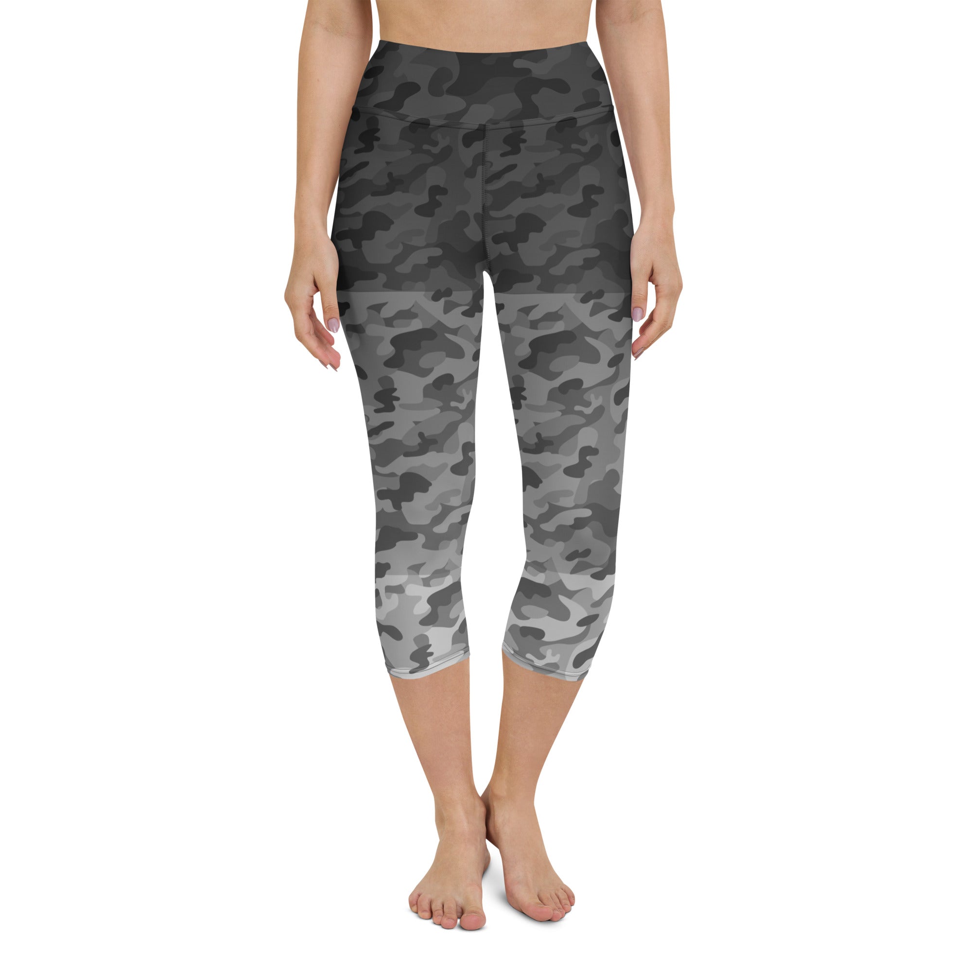 Introducing our Stealth Yoga Capri Leggings, the perfect blend of style, comfort, and performance. These leggings feature a unique camouflage gradient pattern, designed to make a statement while providing the versatility you need for any workout.