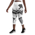 Load image into Gallery viewer, Discover the perfect blend of style and comfort with our Neo Weave yoga capris. These high-waisted capris feature a cutting-edge geometric design that's sure to turn heads at the gym or on the street. The quick-dry, moisture-wicking fabric keeps you cool and dry even during your toughest workouts, while the four-way stretch ensures unrestricted movement.
