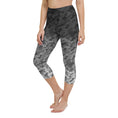 Load image into Gallery viewer, Introducing our Stealth Yoga Capri Leggings, the perfect blend of style, comfort, and performance. These leggings feature a unique camouflage gradient pattern, designed to make a statement while providing the versatility you need for any workout.
