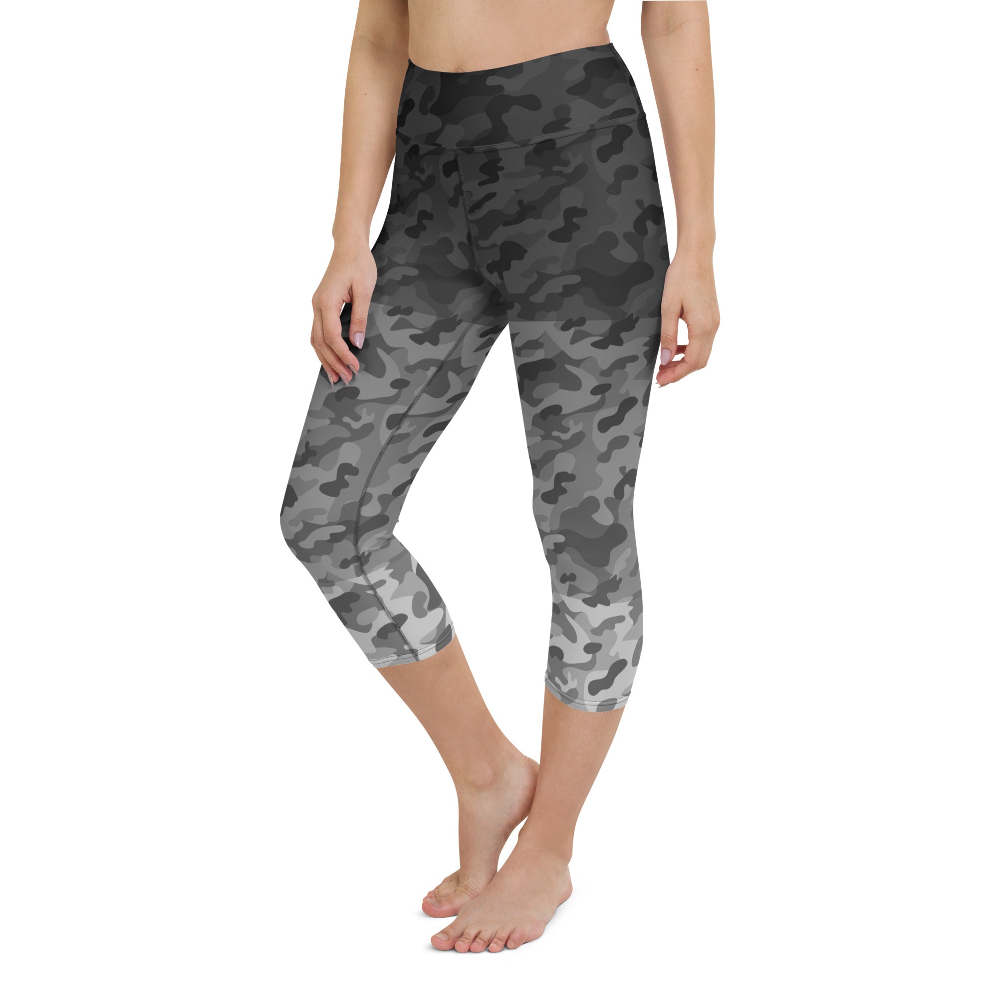 Introducing our Stealth Yoga Capri Leggings, the perfect blend of style, comfort, and performance. These leggings feature a unique camouflage gradient pattern, designed to make a statement while providing the versatility you need for any workout.