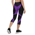 Load image into Gallery viewer, Indulge in the ultimate comfort with our Midnight Hex Capri Leggings. These leggings feature a bold and unique design of purple curves and hexagon patterns on a sleek black background, making them perfect for any activity.
