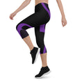 Load image into Gallery viewer, Indulge in the ultimate comfort with our Midnight Hex Capri Leggings. These leggings feature a bold and unique design of purple curves and hexagon patterns on a sleek black background, making them perfect for any activity.
