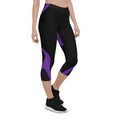 Load image into Gallery viewer, Indulge in the ultimate comfort with our Midnight Hex Capri Leggings. These leggings feature a bold and unique design of purple curves and hexagon patterns on a sleek black background, making them perfect for any activity.
